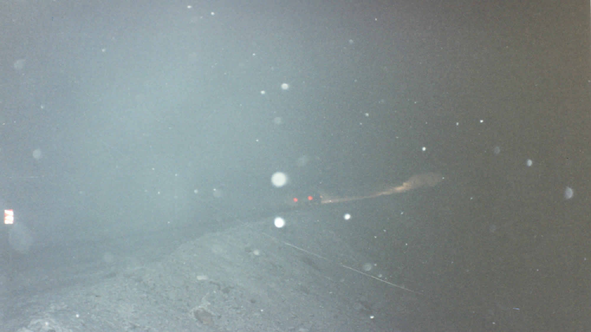 Photo of snow and the pickup driving up through the pass from Lago Escondida and down into Ushuaia