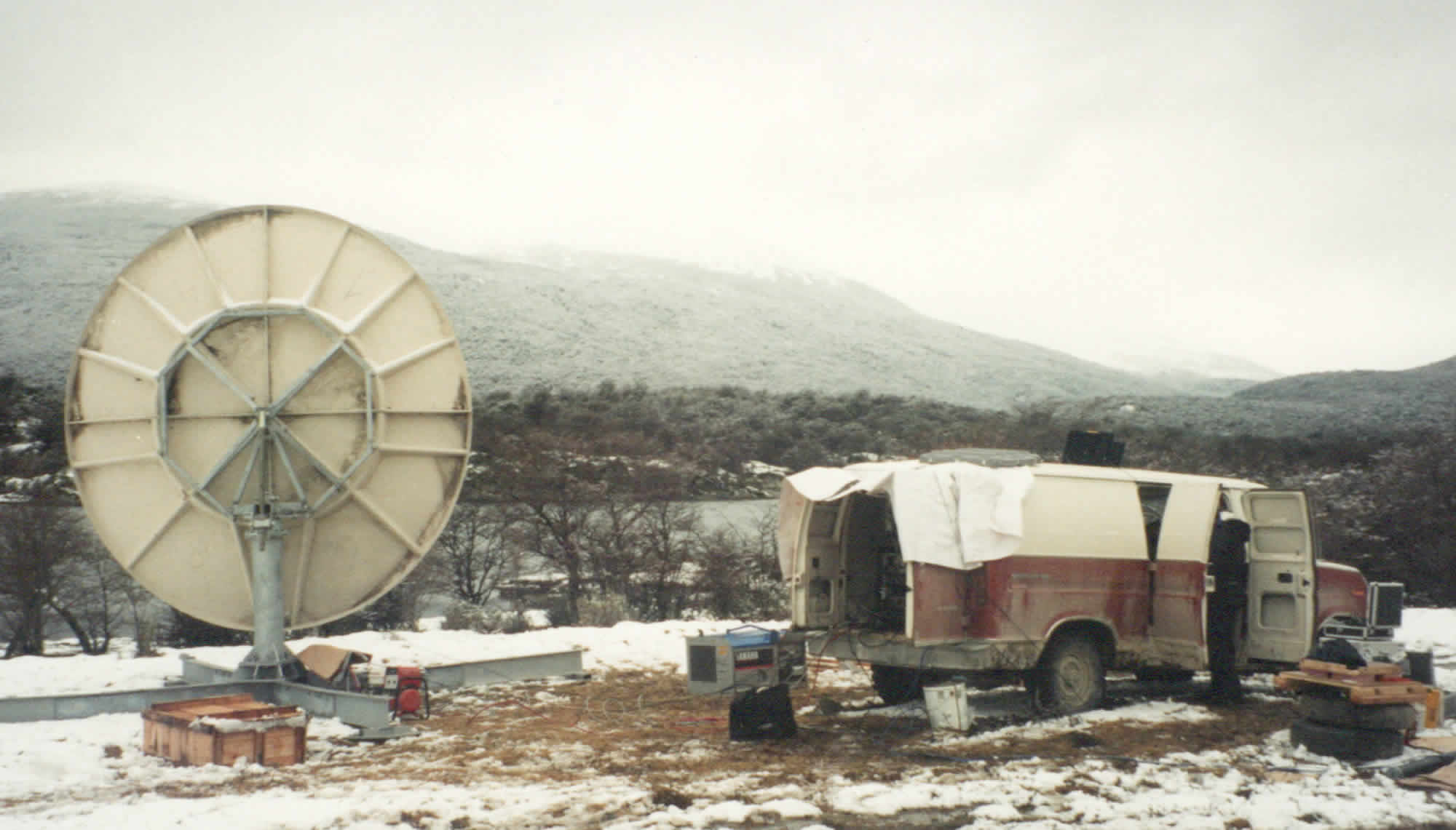 Photo of a satellite dish pointing straight at a mountain from Bahia Ensenada bay