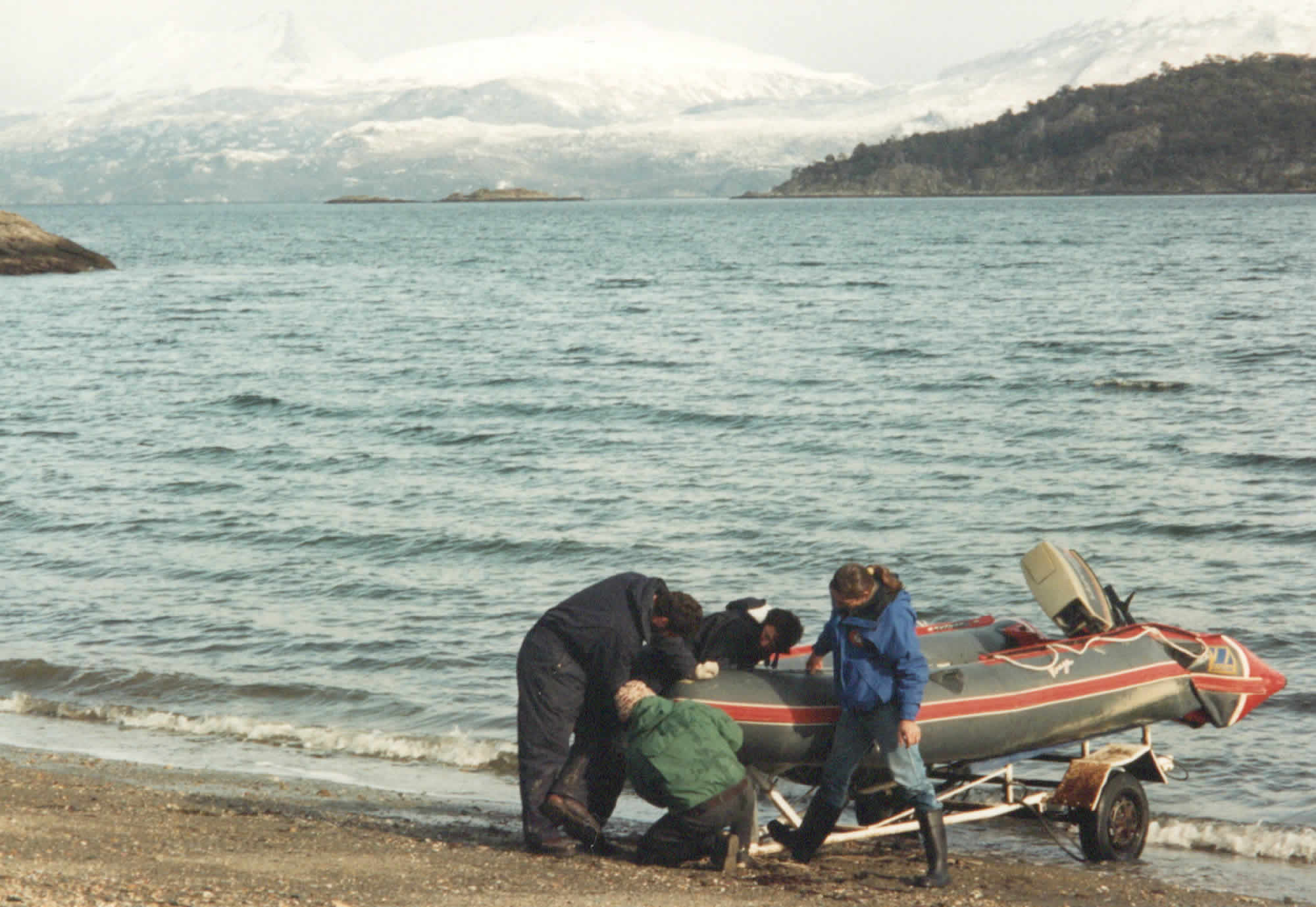 Photo of the Keytech satellite engineers launching an inflatable to take two microwave dishes out to Isla de Tierra del Fuego