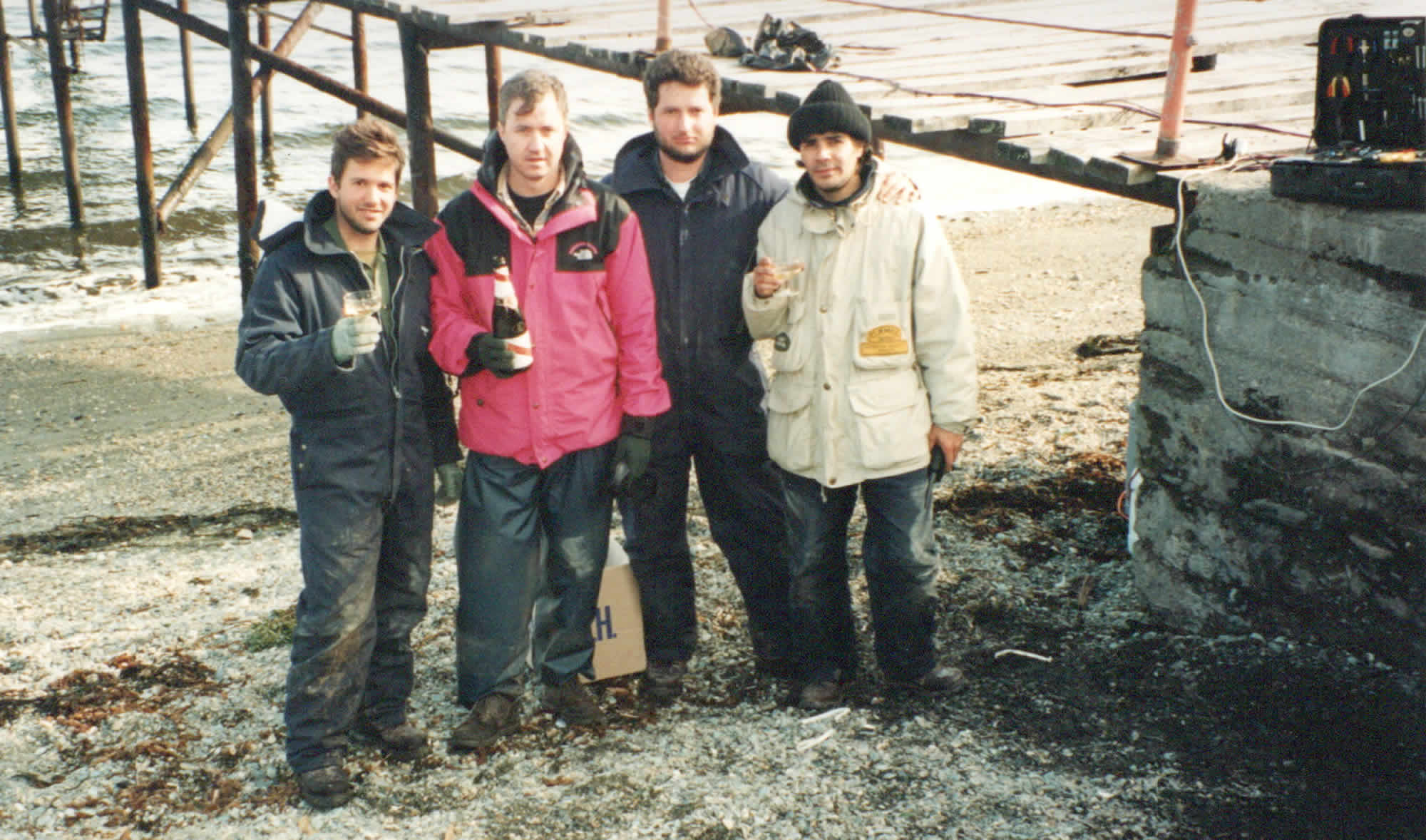 Photo of the author and satelite engineering crew drinking champagne near the Bahia Ensenada jetty